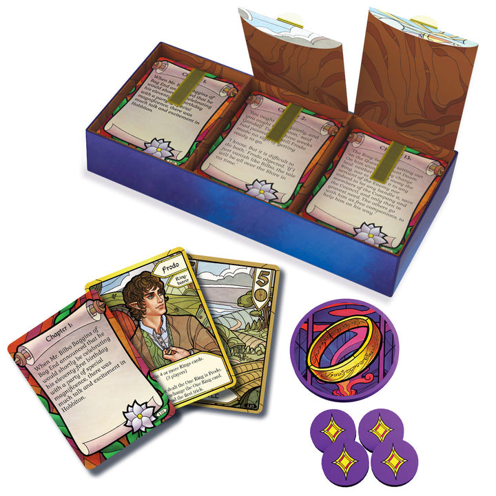 The Fellowship of the Ring: Trick-Taking Game - Open game box with three stacks of illustrated playing cards featuring fantasy artwork, along with a circular token.