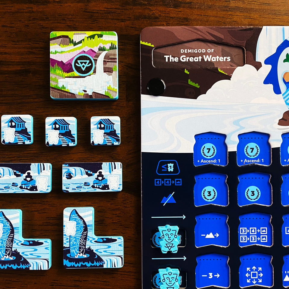 Oros Collector's Edition - Strategy board game components with colorful terrain tiles, blue and white plastic markers, and a detailed game board.