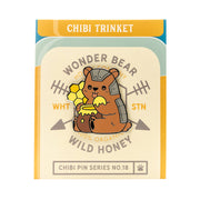 Critical Role Chibi Pin - Trinket - Round enamel pin featuring a brown bear in gray armor holding yellow honeycomb, chibi style.