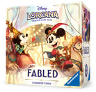 Lorcana TCG: Fabled Illumineer's Trove - Disney Lorcana trading card game box with colorful fantasy artwork featuring Mickey Mouse in medieval attire, gold and cream