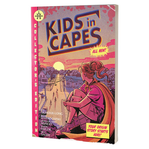 Kids in Capes - Softcover book with illustrated cover showing a girl in a red cape sitting contemplatively by a sunset-lit bridge, titled.