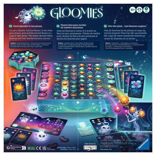 Gloomies - Colorful board game with glowing orbs, character cards, and a galaxy-themed play mat under starry sky backdrop.