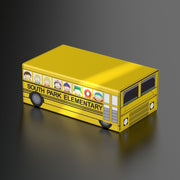 Squaroes: Collectors Case - South Park - Bus - Yellow rectangular collector's case shaped like South Park Elementary bus with character windows and black wheels.