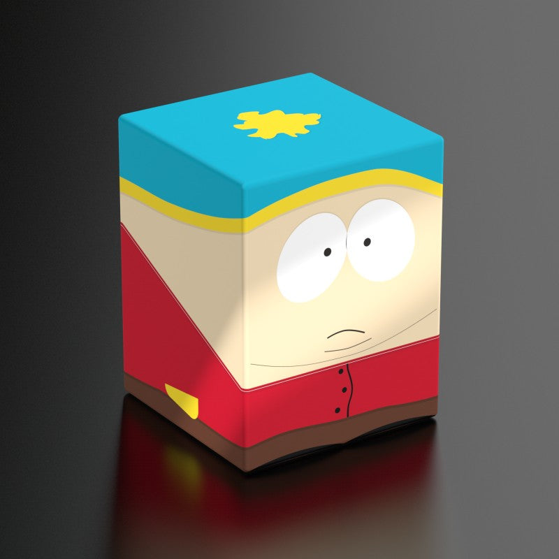 Squaroes: 100+ Deckbox - South Park - Cartman - Square deck box featuring South Park's Cartman with beige, red, and blue colors and yellow emblem on top.