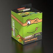 Squaroes: 100+ Deckbox -Teenage Mutant Ninja Turtles - Michelangelo - Green rectangular deck box with Michelangelo from Teenage Mutant Ninja Turtles winking, orange mask, and smiling face design.