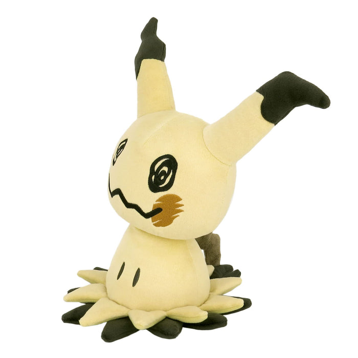 Pokémon All Star Collection - Mimikyu 10" Plush - Soft cream-colored Mimikyu plush with black-tipped ears, round black eyes, and a jagged mouth, sitting on a black and yellow