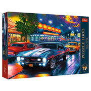 Puzzle: Tea Time: Night Drive 1000 Piece - 1000-piece jigsaw puzzle featuring a vivid retro night scene with classic cars cruising past a brightly lit diner and neon.