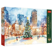 Puzzle: Central Park Winter Wonderland 1000 Piece - 1000-piece puzzle box featuring watercolor winter scene of Central Park with decorated Christmas tree and city skyline.