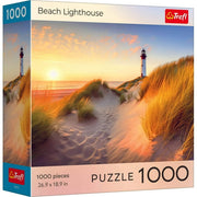 Puzzle: Sunsets Beach Lighthouse 1000 Piece - 1000-piece puzzle box featuring a sunset beach scene with a lighthouse and sand dunes with tall grasses.