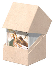 Ultimate Guard Boulder 100+ Return to Earth - Natural - Natural beige textured card deck box with angled lid, holding clear card sleeves with illustrated cards inside.