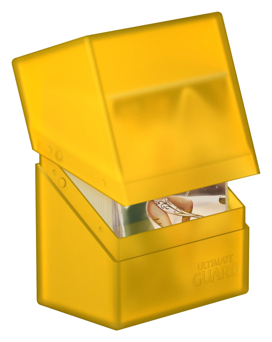 Ultimate Guard Boulder 60+ Deck Case - Amber - Amber-colored plastic deck case with hinged lid partially open, compact rectangular shape.