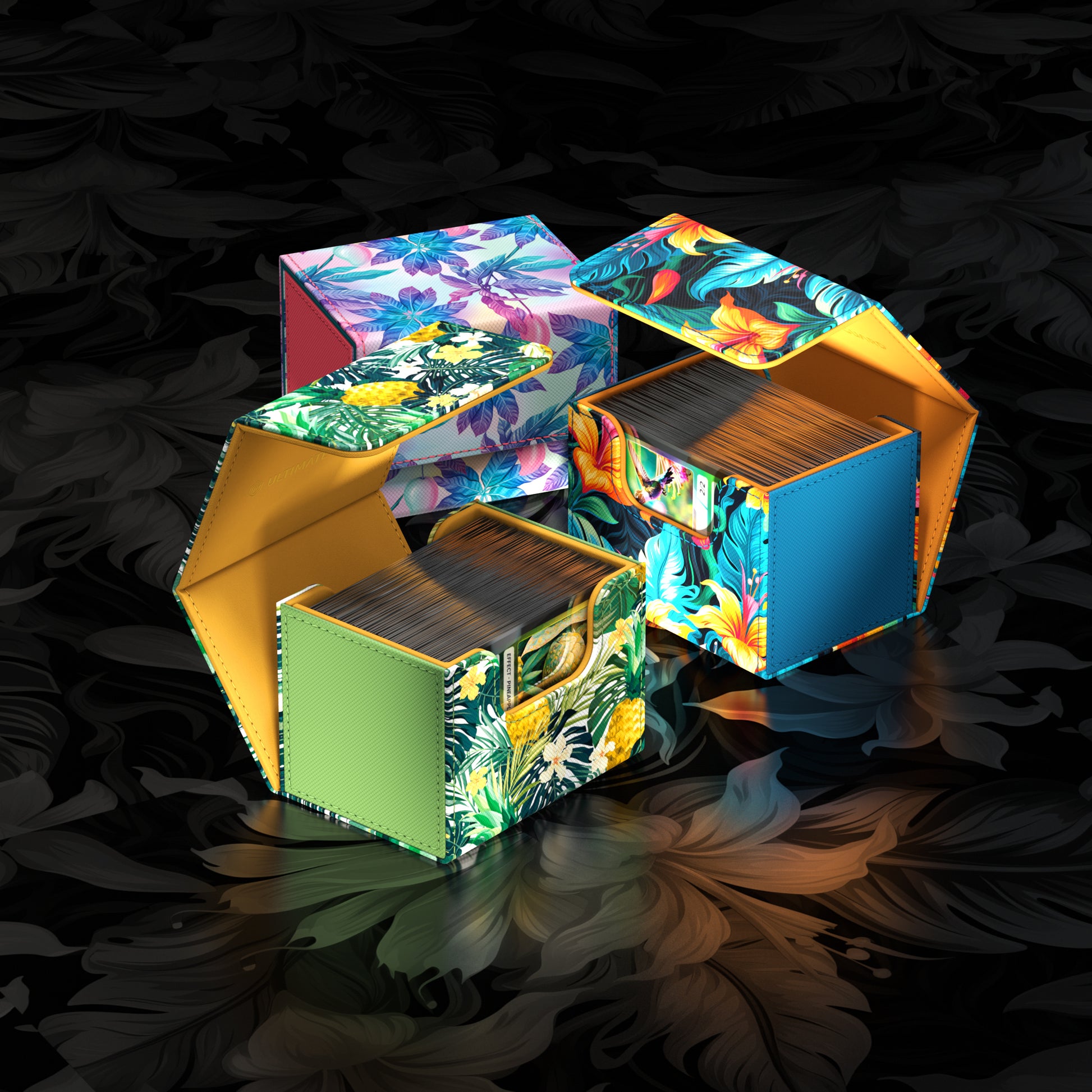 Ultimate Guard Sidewinder 100+ Deck Box - Floral Places II - Two floral-patterned rectangular deck boxes in bright colors with cards inside, designed for card storage and protection.