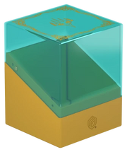 Ultimate Guard Boulder 100+: Lorwyn Eclipsed - Changelings - Translucent teal plastic card storage box with a gold base and delicate gold detailing on the lid.