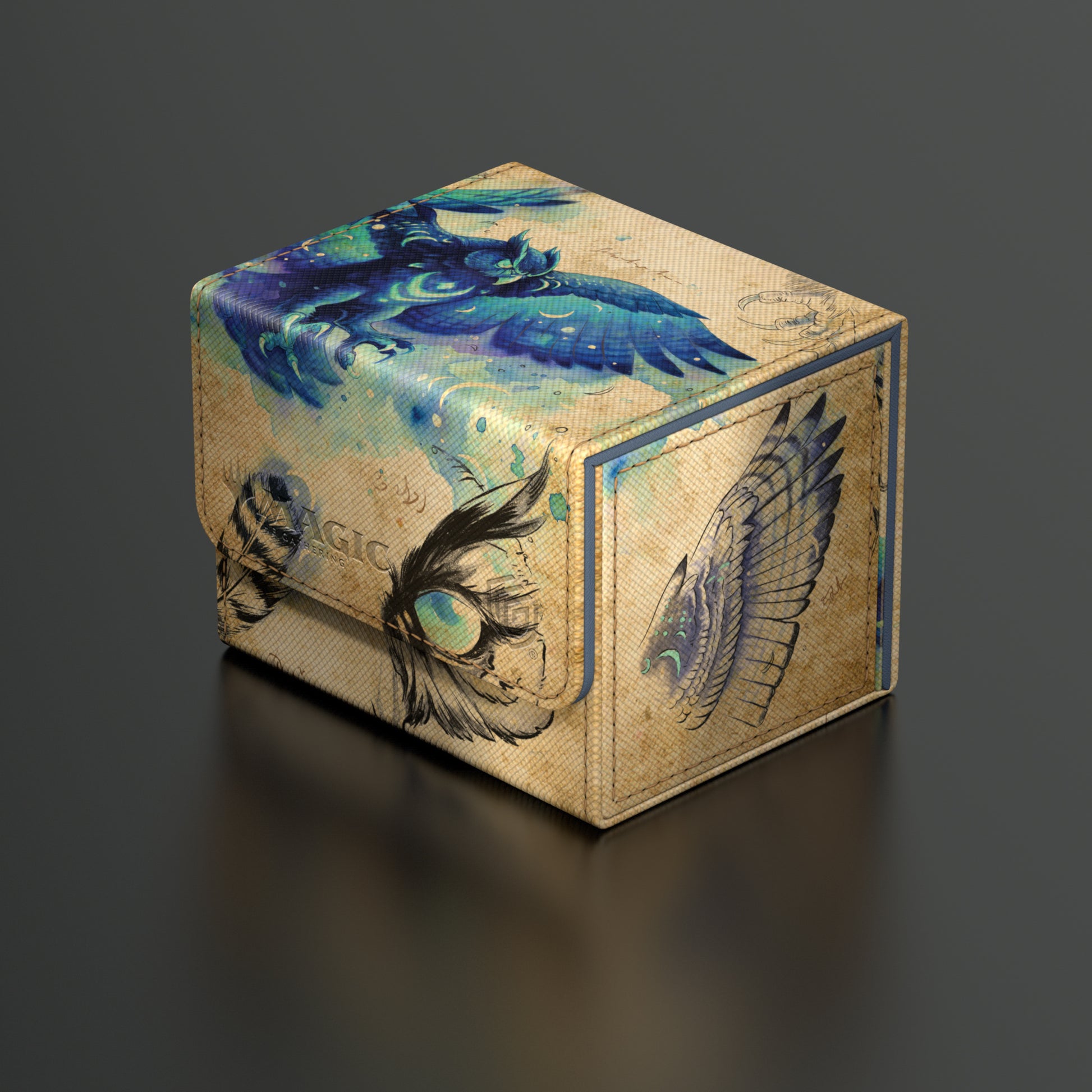 Ultimate Guard Sidewinder 100+ Deck Box: Bloomburrow - Maha, Its Featherless Night - Rectangular deck box with beige, blue, and black fantasy-themed artwork featuring a blue dragon and mystical feathers.
