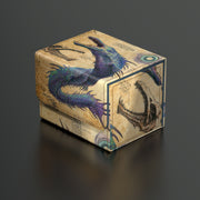 Ultimate Guard Sidewinder 100+ Deck Box: Bloomburrow - Eluge, the Shoreless Sea - Rectangular deck box with textured beige surface featuring blue and purple mythical sea creature artwork and nautical anchor