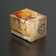 Ultimate Guard Sidewinder 100+ Deck Box: Bloomburrow - Sunspine Lynx - Rectangular deck box with a sunset orange and beige design featuring a fiery lynx illustration and nature-themed patterns.