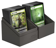 Ultimate Guard Boulder 100+ Solid Color - Grey - Grey plastic card storage box with slanted front edges holding two rows of trading cards.