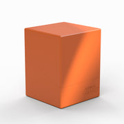 Ultimate Guard Boulder 100+ Solid Color - Orange - Bright orange rectangular deck box with smooth matte finish and subtle embossed logo on the lower corner.