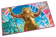 Ultimate Guard: Play-Mat Magic: The Gathering - Aetherdrift - Sab-Sunen, Luxa Embodied - Rectangular playmat featuring vibrant fantasy artwork of a golden armored frog warrior holding a staff, with a colorful.