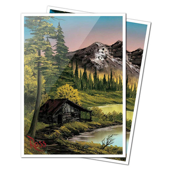 Deck Protector: Apex: Bob Ross: Mountain Retreat - Rectangular skateboard deck with colorful mountain landscape featuring a cabin, tall pine trees, and a river at sunset.