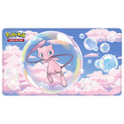 Ultra Pro Foil Playmat: Pokémon - Mew Mythical (PREORDER) - Rectangular playmat with pastel blue and pink sky background, featuring pink Pokémon Mew inside a large transparent bubble.