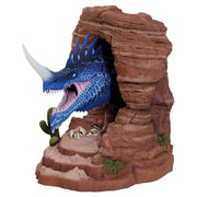 D&D Bookend: Blue Dragon - Blue dragon head with sharp teeth and white horn emerging from textured red rock cave bookend with desert plants and skulls.