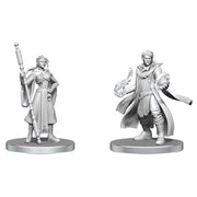 Critical Role Unpainted Miniatures: Beauregard Lionett & Caleb Widogast - Unpainted gray resin miniatures of a female warrior with a staff and a male mage casting spells, both on round bases.