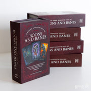 Game Master's Deck of Boons and Banes - Dark red rectangular box with fantasy artwork of a sorcerer and fire, labeled Game Master's Deck of Boons and Banes.