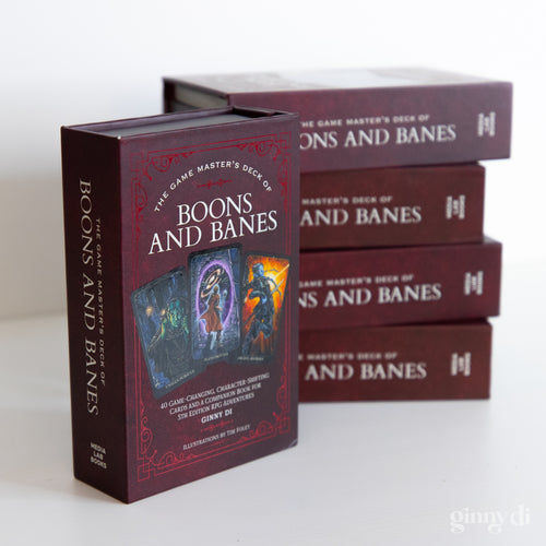 Game Master's Deck of Boons and Banes - Dark red rectangular box with fantasy artwork of a sorcerer and fire, labeled Game Master's Deck of Boons and Banes.