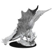 D&D Nolzur's Marvelous Miniatures: Young Gold Dragon - Unpainted resin miniature of a young dragon with detailed scales, large wings, and a crouched pose on a round base.