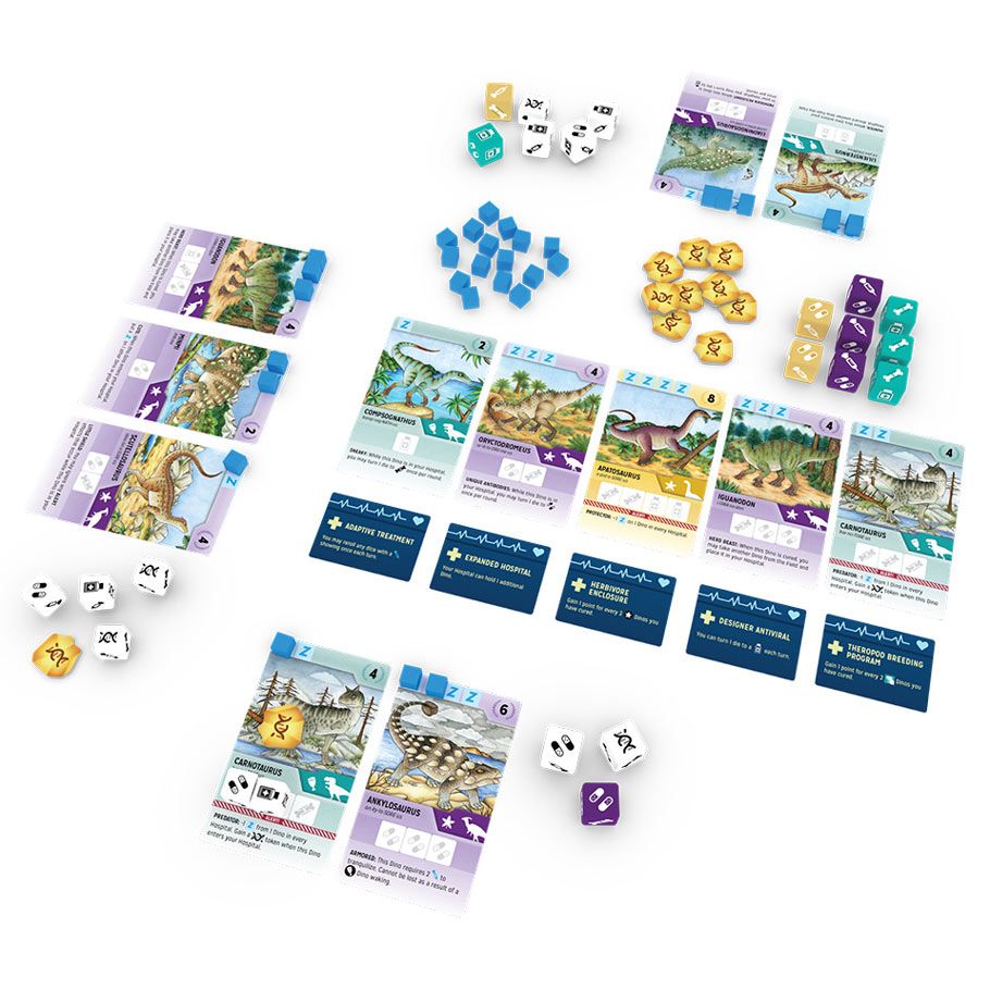 PaleoVet - Card game setup with colorful dinosaur-themed cards, purple and blue dice, yellow tokens, and small blue cubes arranged on a