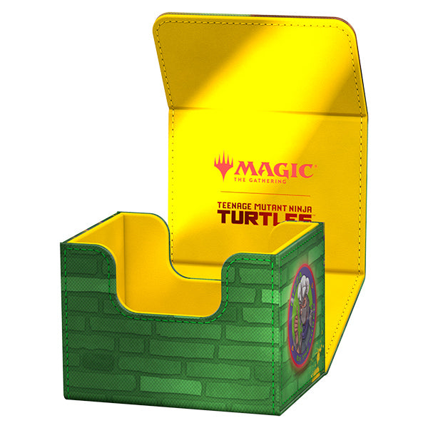 Ultimate Guard Sidewinder 100+ Xenoskin Deck Case: Teenage Mutant Ninja Turtles - Forest - Green brick-patterned deck case with Ninja Turtles logo, yellow interior, Magic The Gathering branding.