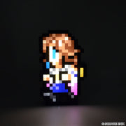 Final Fantasy Pixelight Neo: FFRK Yuna (PREORDER) - Pixelated Yuna character light with brown hair, blue eyes, white top, and purple skirt on black background.