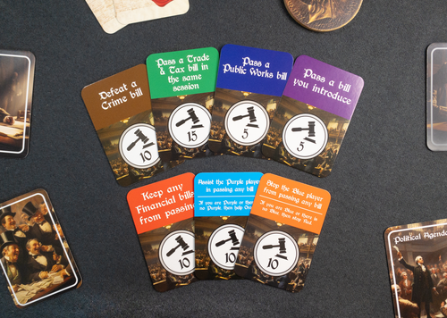Politics! - Colorful rectangular cards with various political-themed questions and white circular icons on a dark surface.