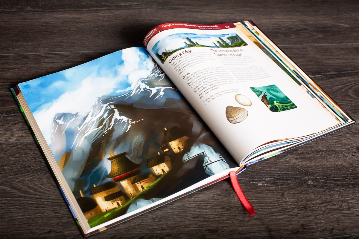 World of Arzium RPG - Open fantasy RPG book with colorful mountain village illustration and detailed character stats pages on dark wooden surface.