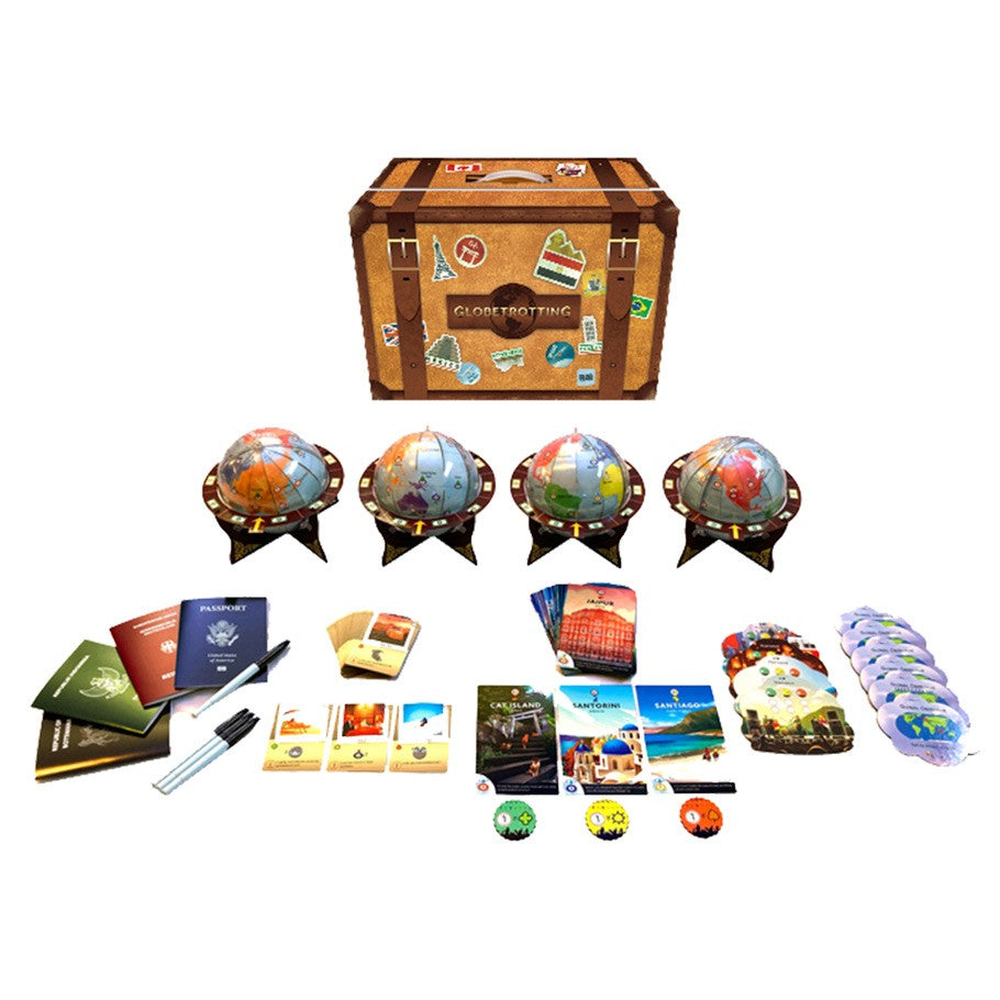 Globetrotting - Wooden suitcase-style box with travel stickers, four miniature globes on stands, colorful cards, passports, tokens, and a.
