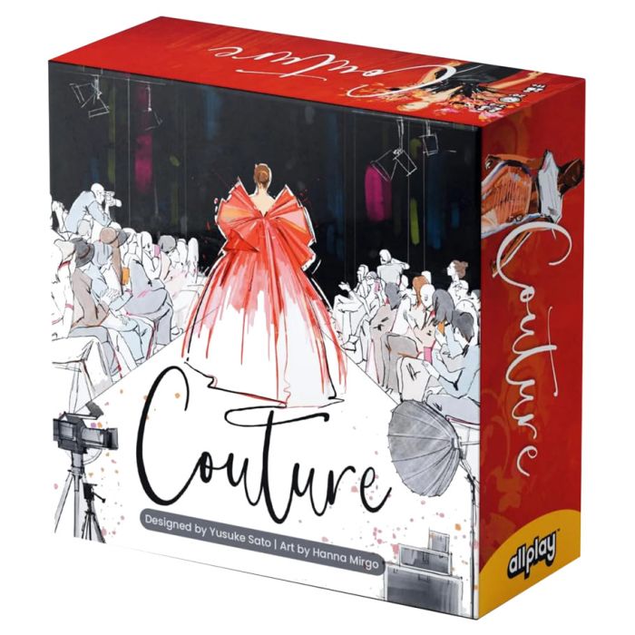 Couture - Card game box featuring fashion illustration of a red couture gown on runway with audience and studio lights.
