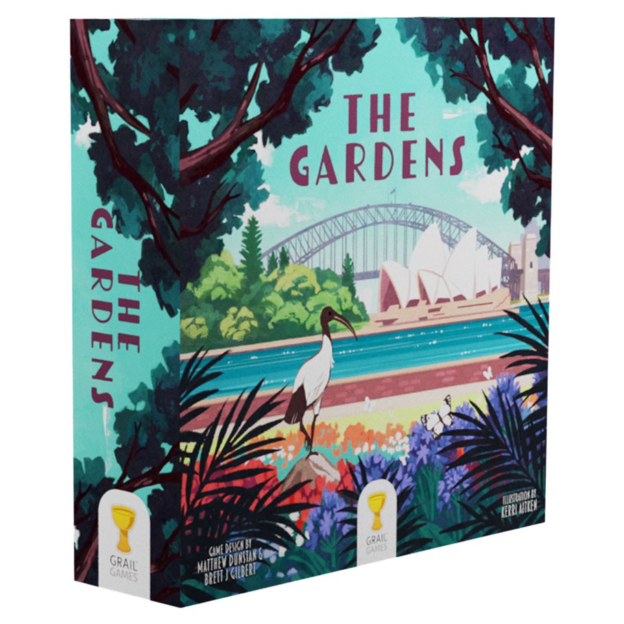 The Gardens - Square board game box with colorful illustrated garden scene, featuring a crane, tropical plants, and city skyline backdrop.