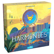 Harmonies - Colorful board game box with a lion illustration on a circular dial over a vibrant landscape background labeled Harmonies.