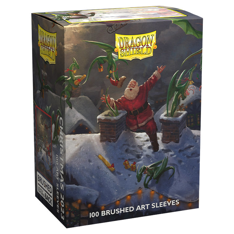Dragon Shield Sleeves - 100ct Box Brushed Art - Christmas 2023 - Box of 100 Dragon Shield brushed art card sleeves featuring Santa battling green dragons in snowy landscape.