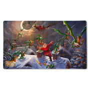 Dragon Shield Playmat and Tube - Christmas 2023 - Rectangular playmat featuring a festive scene with Santa Claus and green dragons flying over snowy rooftops under a full.