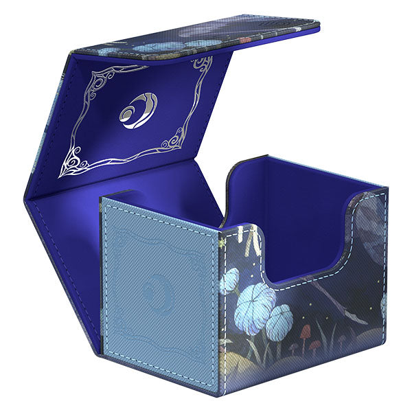 Ultimate Guard Sidewinder 100+ Xenoskin Deckcase: Lorwyn Eclipsed - Bitterbloom Bearer - Blue and purple hard deck box with floral and fantasy-themed artwork, hinged lid, and stitched edges.