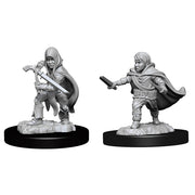 D&D Nolzur's Marvelous Miniatures: Halfling Rogue Male - Unpainted gray plastic miniatures of a halfling rogue male with a hooded cloak, one holding a dagger and the other a short.