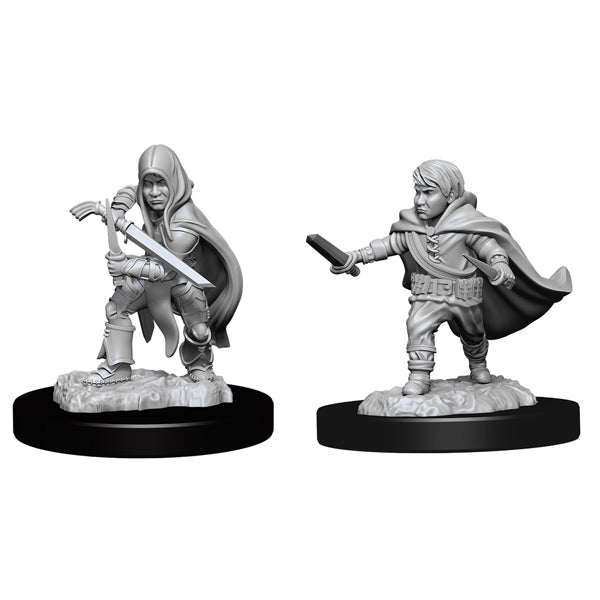 D&D Nolzur's Marvelous Miniatures: Halfling Rogue Male - Unpainted gray plastic miniatures of a halfling rogue male with a hooded cloak, one holding a dagger and the other a short.