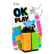 OK Play - Colorful stacked plastic blocks in orange, yellow, green, and blue with a black clip on top, packaged with a card labeled OK