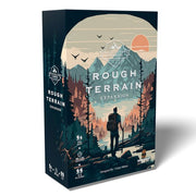 Bear Mountain Camping Adventure: Rough Terrain Expansion - Tall rectangular game box with dark blue and orange mountain artwork, showing a hiker overlooking a forest at sunset, titled
