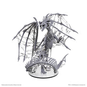 D&D Nolzur’s Marvelous Unpainted: Black Dracolich - Unpainted gray plastic miniature of a skeletal dragon with tattered wings and detailed bone structure on a round base.