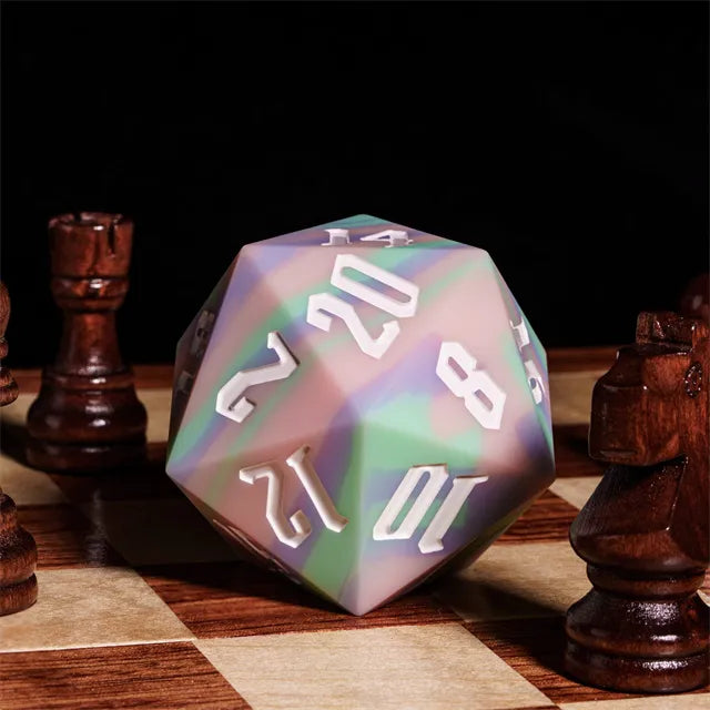 Giant Bouncy D20 - Pastel Stripes - Giant pastel striped d20 dice with white numbers on a chessboard surrounded by wooden chess pieces.