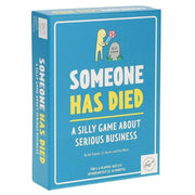 Someone Has Died - Blue rectangular card game box with yellow and white text "Someone Has Died" and cartoon of a person holding a flower by a.