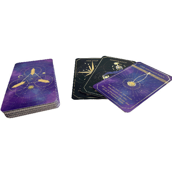 Phantom Ink: Arcana - Stack of rectangular cards with purple and black backs featuring gold mystical symbols and text, some cards fanned out.